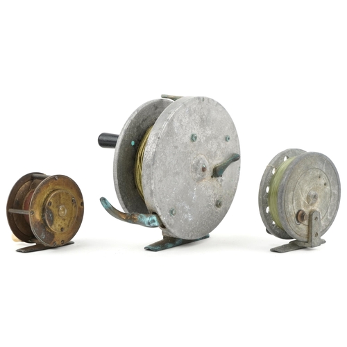 2403 - Three vintage fishing reels including a deep sea reel, the largest 15cm in diameter