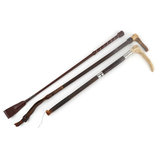 1426 - Three leather riding crops including one with horn handle and silver collar