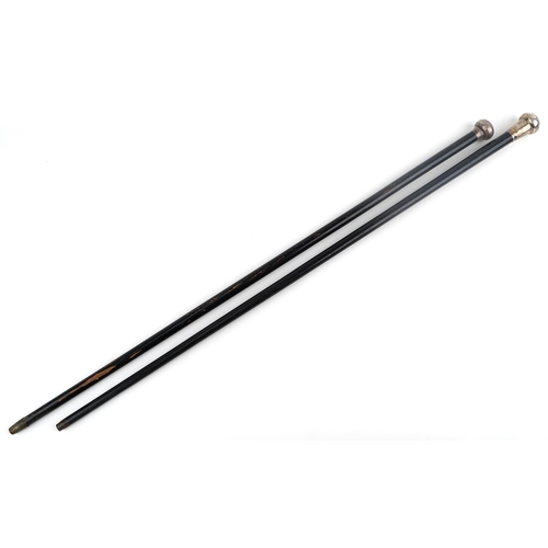 223 - Two ebonised walking sticks with silver handles, 91cm in length