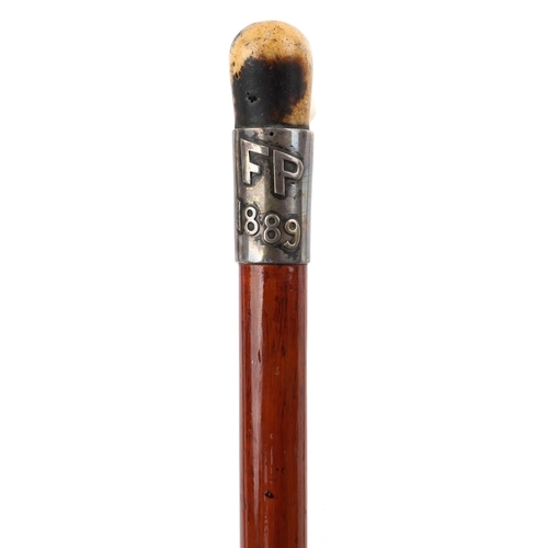 219 - Four walking sticks with horn handles, one with silver collar, the largest 88cm in length