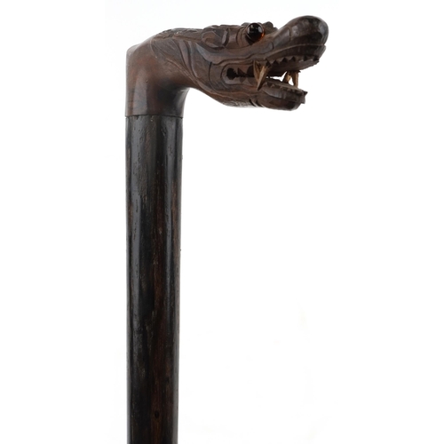 1424 - Rosewood walking stick with carved Chinese dragon head handle, 90cm in length