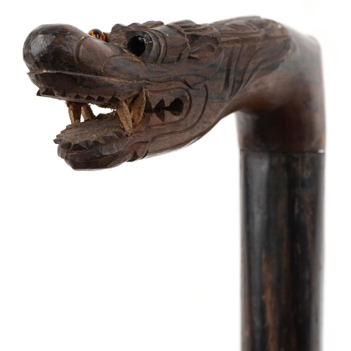 1424 - Rosewood walking stick with carved Chinese dragon head handle, 90cm in length