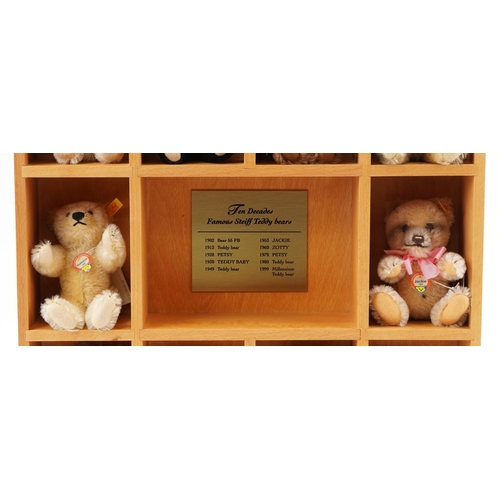 2044 - Ten Decades of Famous Steiff Teddy Bears with display stand and box, 60cm high