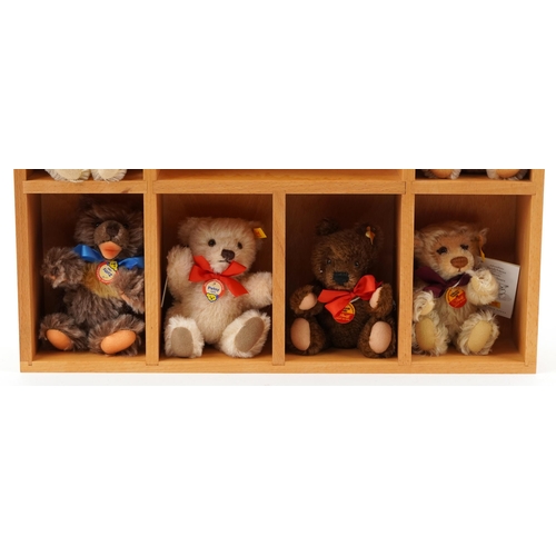 2044 - Ten Decades of Famous Steiff Teddy Bears with display stand and box, 60cm high