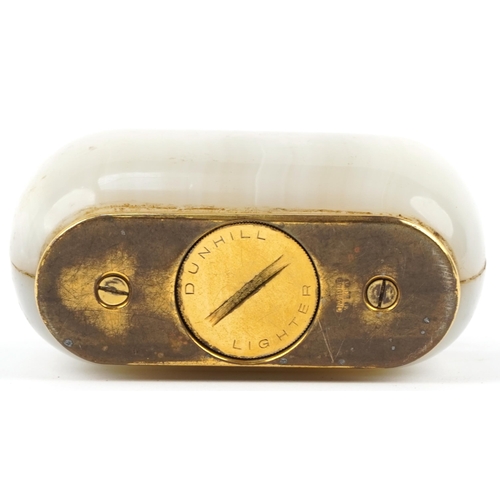 71 - Dunhill onyx and brass table lighter, 10cm wide