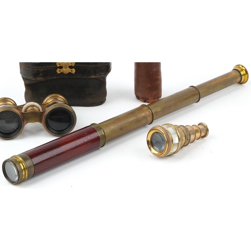 130 - Optical instruments comprising a brass three draw telescope, pair of R Treuer opera glasses and a mo... 