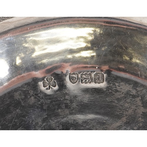 62 - W G Connell, Arts & Crafts circular silver dish embossed with stylized dragon and Green Man, London ... 