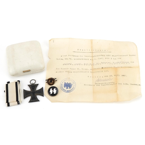 2586 - German military interest enamelled SS badge and Iron Cross with paperwork