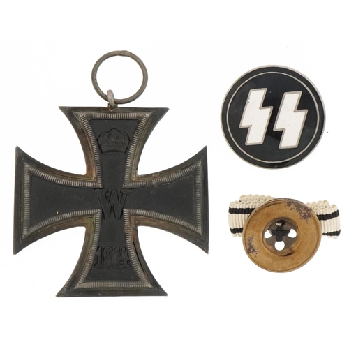 2586 - German military interest enamelled SS badge and Iron Cross with paperwork