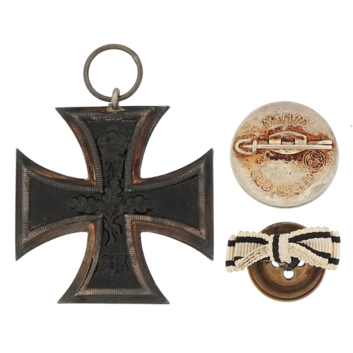 2586 - German military interest enamelled SS badge and Iron Cross with paperwork