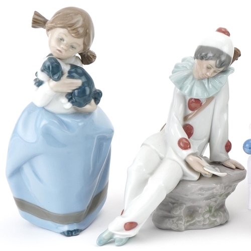 491 - Six Nao porcelain clowns and girl with puppy, the largest 19cm high