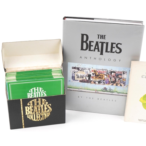 637 - The Beatles memorabilia including The Beatles Singles record Collection 1962-1970 and hardback books