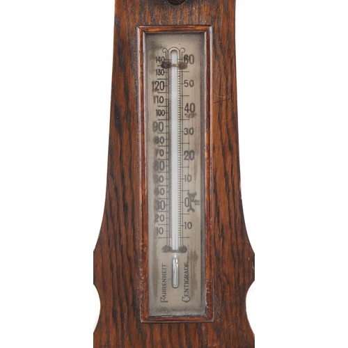 234 - Carved oak wall barometer with silvered dial, 73cm high