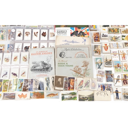 2305 - Extensive collection of early 20th century and later cigarette cards and tea cards, some arranged in... 