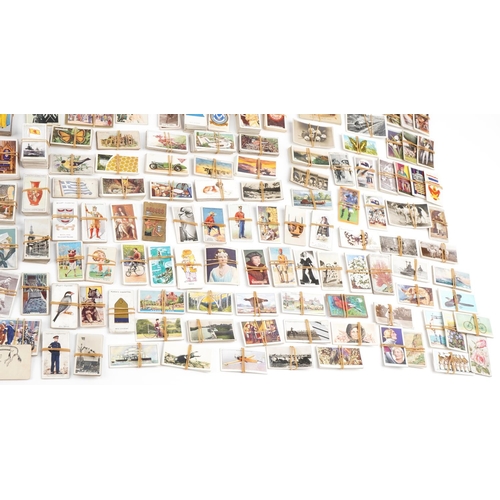 2305 - Extensive collection of early 20th century and later cigarette cards and tea cards, some arranged in... 