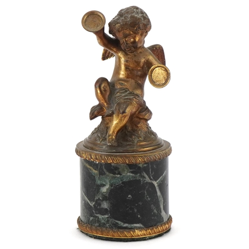 125 - Gilt bronze figure of Putti raised on a cylindrical green marble base, 19cm high