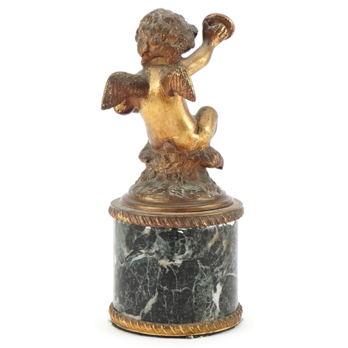 125 - Gilt bronze figure of Putti raised on a cylindrical green marble base, 19cm high