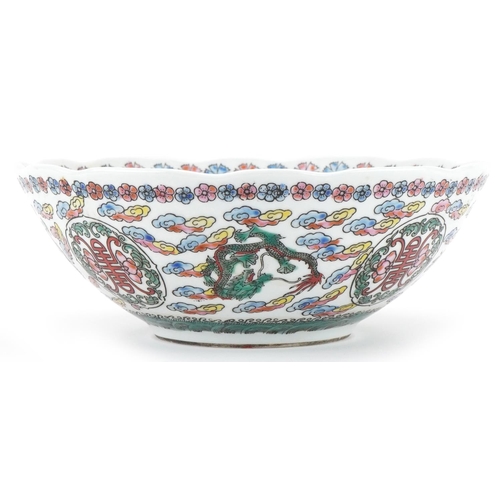 1417 - Chinese porcelain bowl profusely decorated with dragons amongst clouds, 21.5cm in diameter