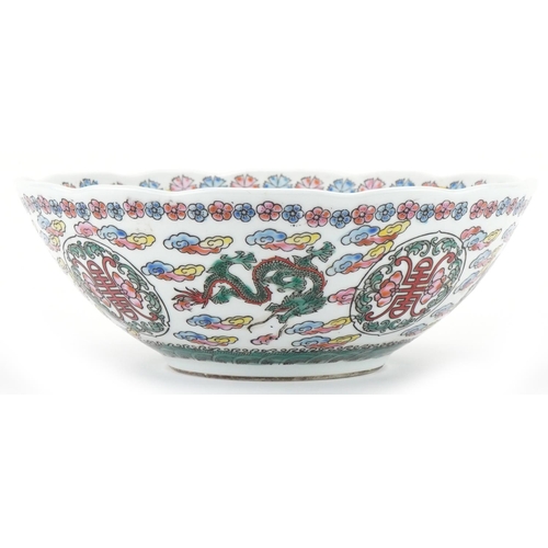 1417 - Chinese porcelain bowl profusely decorated with dragons amongst clouds, 21.5cm in diameter