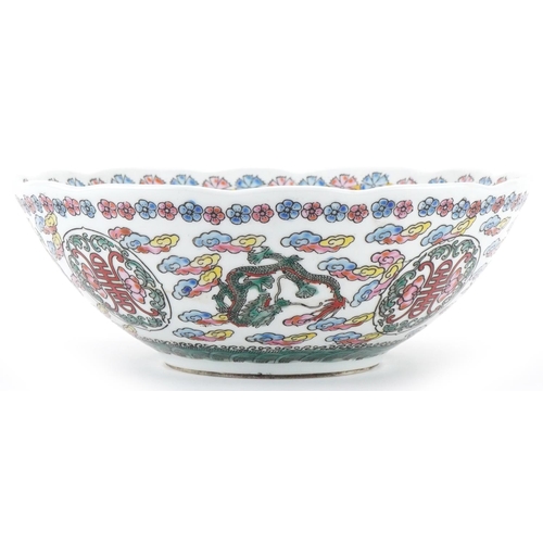 1417 - Chinese porcelain bowl profusely decorated with dragons amongst clouds, 21.5cm in diameter