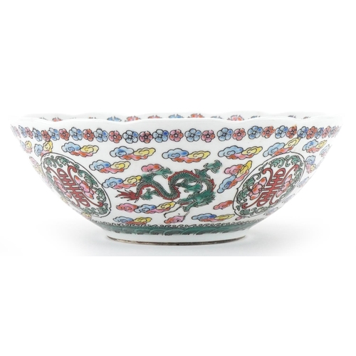 1417 - Chinese porcelain bowl profusely decorated with dragons amongst clouds, 21.5cm in diameter