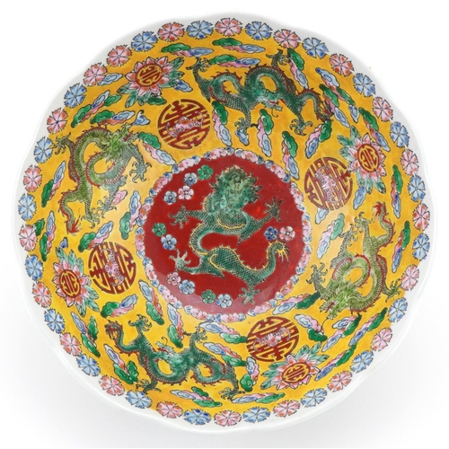 1417 - Chinese porcelain bowl profusely decorated with dragons amongst clouds, 21.5cm in diameter