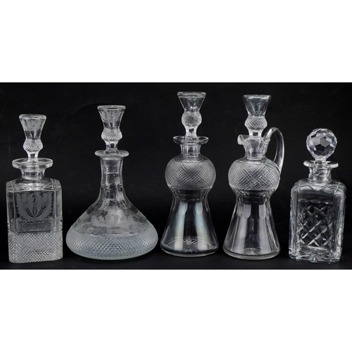 611 - Five good quality cut glass decanters with stoppers, four etched and cut with thistles, the largest ... 