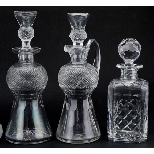 611 - Five good quality cut glass decanters with stoppers, four etched and cut with thistles, the largest ... 