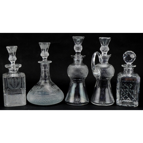 611 - Five good quality cut glass decanters with stoppers, four etched and cut with thistles, the largest ... 