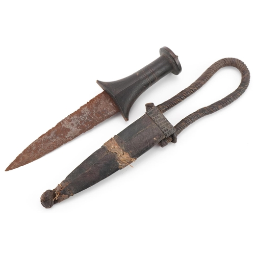 90 - Middle Eastern dagger with wooden grip and leather sheath, 26cm in length