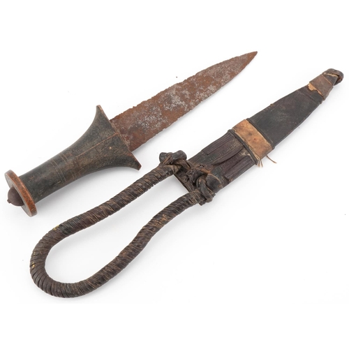 90 - Middle Eastern dagger with wooden grip and leather sheath, 26cm in length