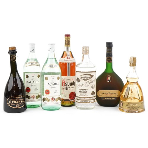 602 - Eight bottles of alcohol including Bacardi, Tequila, Bols liqueur and Grand Armagnac