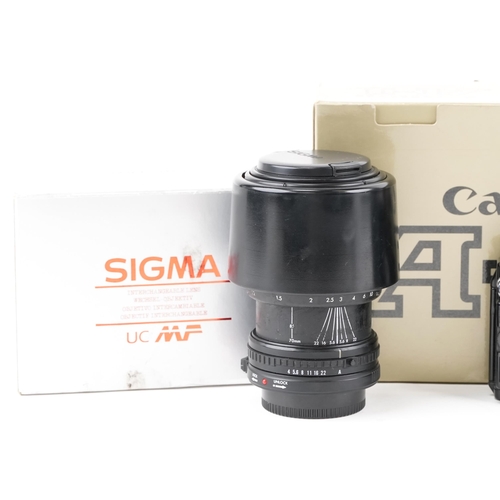 1489 - Canon A-1 camera body and two Sigma lenses with boxes