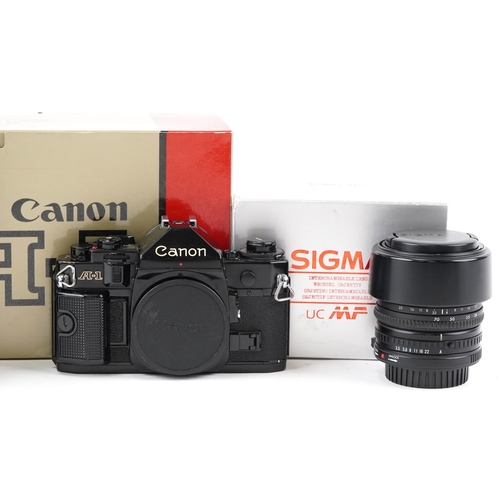 1489 - Canon A-1 camera body and two Sigma lenses with boxes