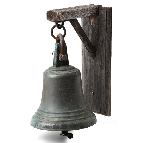 2405 - Patinated bronze ship's bell with wooden bracket mount, the bell 28cm high