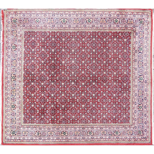 1016 - Rectangular Persian Bidjar rug having and allover geometric design onto a red ground, 250cm x 200cm