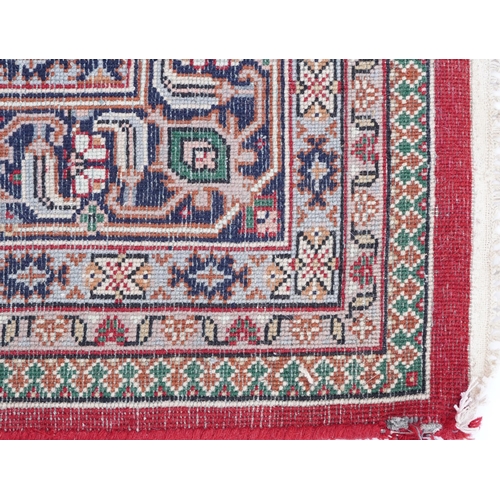 1016 - Rectangular Persian Bidjar rug having and allover geometric design onto a red ground, 250cm x 200cm