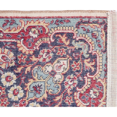 1015 - Rectangular Persian Tabriz rug having and allover floral design onto a cream, red and blue ground, 3... 