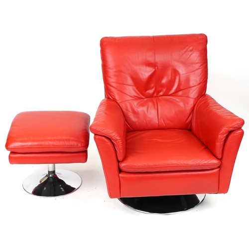 735 - Modern red leather revolving armchair with matching footstool, both on chromium plated circular base... 