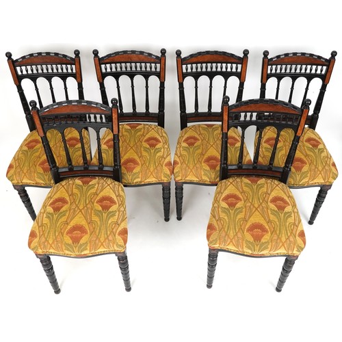 621 - Set of six late Victorian Aesthetic Movement ebonised dining chairs with overstuffed floral upholste... 