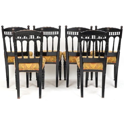 621 - Set of six late Victorian Aesthetic Movement ebonised dining chairs with overstuffed floral upholste... 