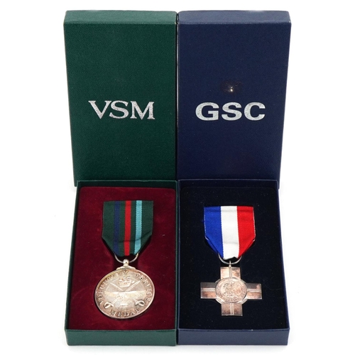 2618 - Two silver military interest medals with boxes for General Service and Voluntary Service awarded to ... 