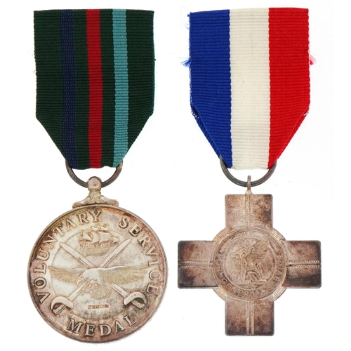 2618 - Two silver military interest medals with boxes for General Service and Voluntary Service awarded to ... 