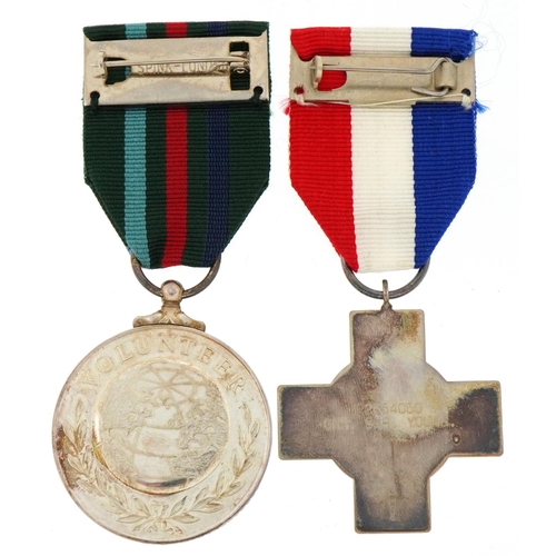 2618 - Two silver military interest medals with boxes for General Service and Voluntary Service awarded to ... 