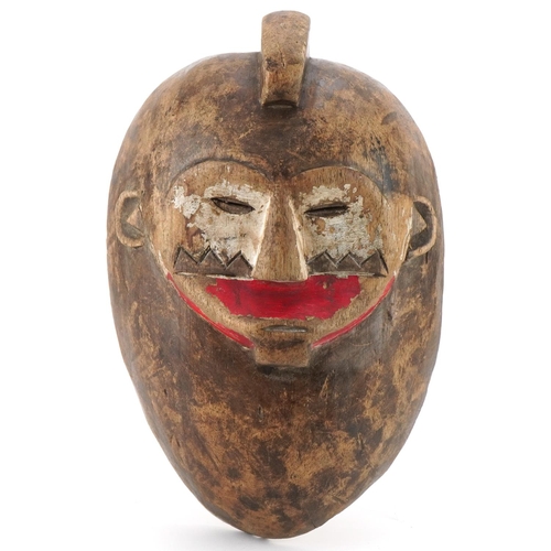 93 - Middle Eastern tribal carved wood wall mask, 35cm high