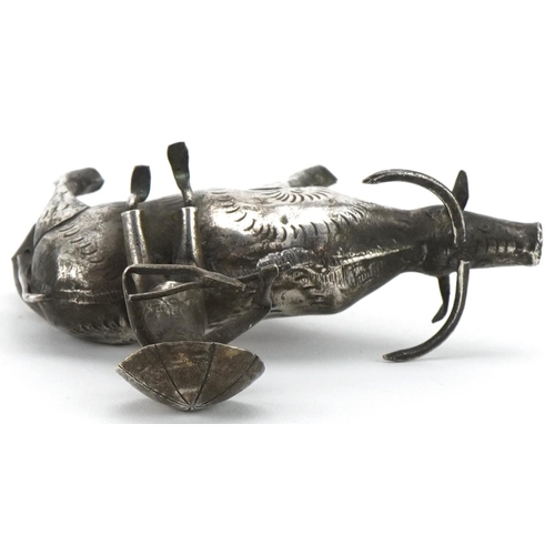 366 - Middle Eastern white metal study of a figure seated on a cow, 10cm in length, 51.2g