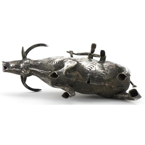 366 - Middle Eastern white metal study of a figure seated on a cow, 10cm in length, 51.2g