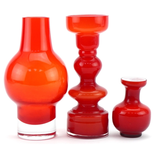 1213 - Three red art glass vases including a Scandinavian example, possibly Finnish, the largest 18.5cm hig... 