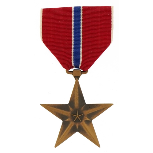 2571 - American military bronze Star medal with bar and ribbon awarded to James G Smithart, housed in a pre... 