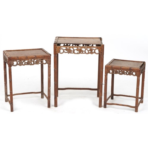 717 - Nest of three Chinese hardwood tables, early 20th century, with carved friezes above faux bamboo tur... 